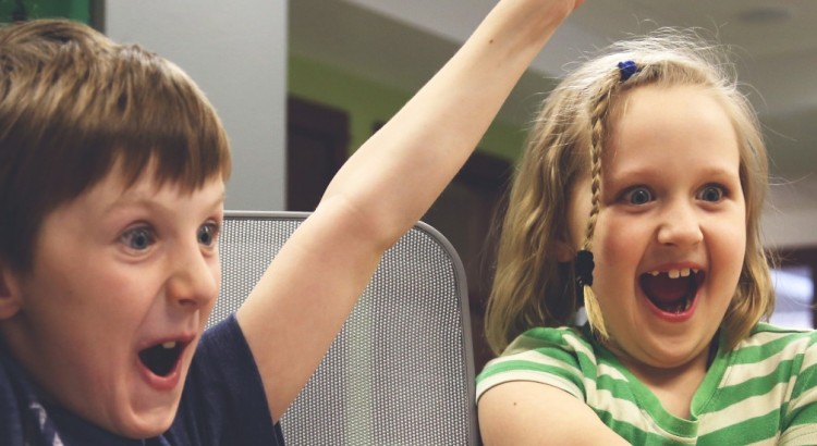 enthusiastic-children-playing-on-computer